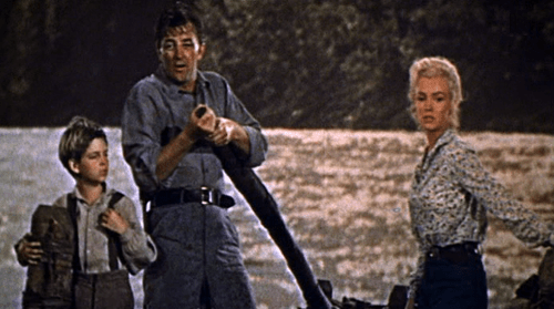 Tommy_Rettig_Robert_Mitchum_and_Marilyn_Monroe_in_River_of_No_Return-e1372153232429